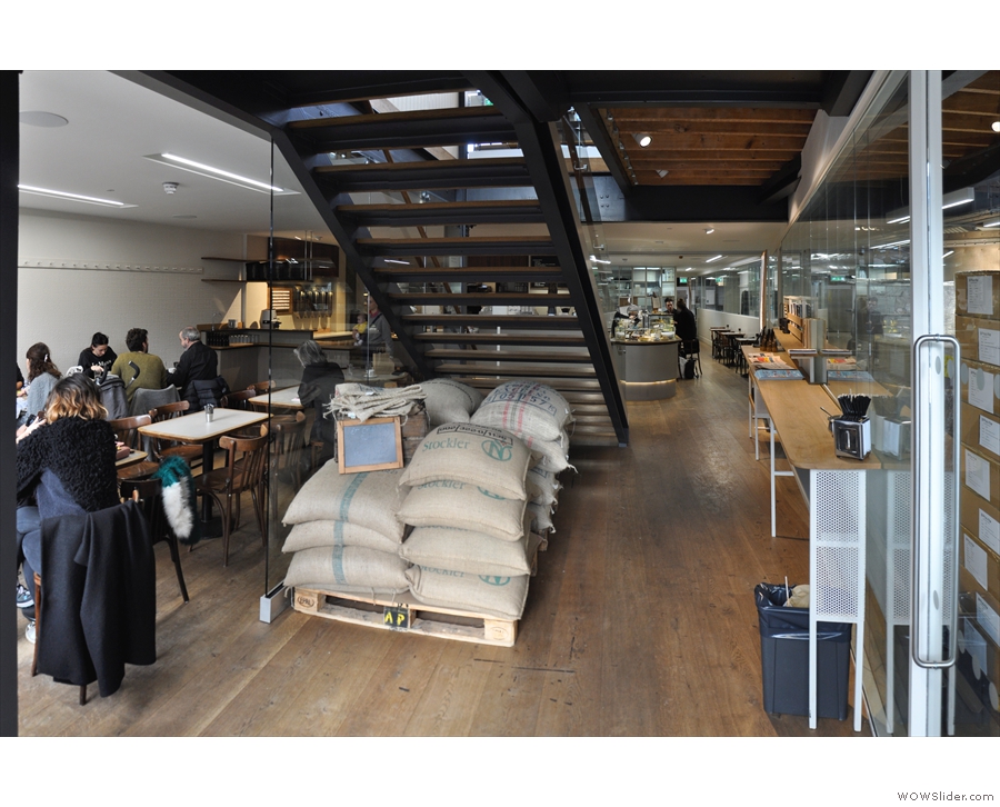 Stepping inside, the site is both a cafe (ahead and to the left) and a roastery (to the right).