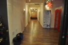In the centre, at the back, a long corridor gives access to meeting rooms and the toilets...