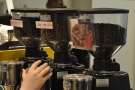 Each bean has its own grinder, with the recipe taped to it, except the decaf (right).