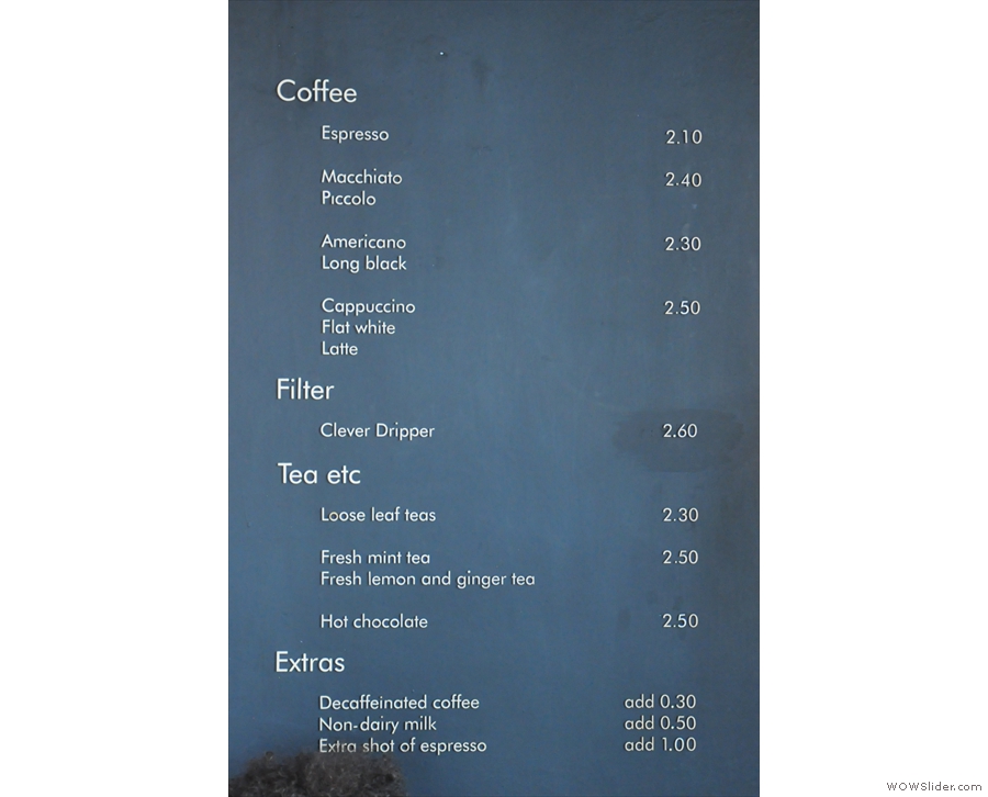 There are other things on the walls, such as the drinks menu (to the right of the counter)...