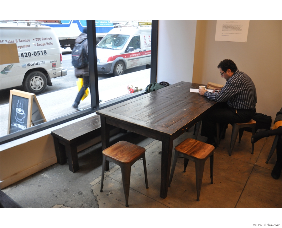 There's a communal table in the window on the left-hand side...