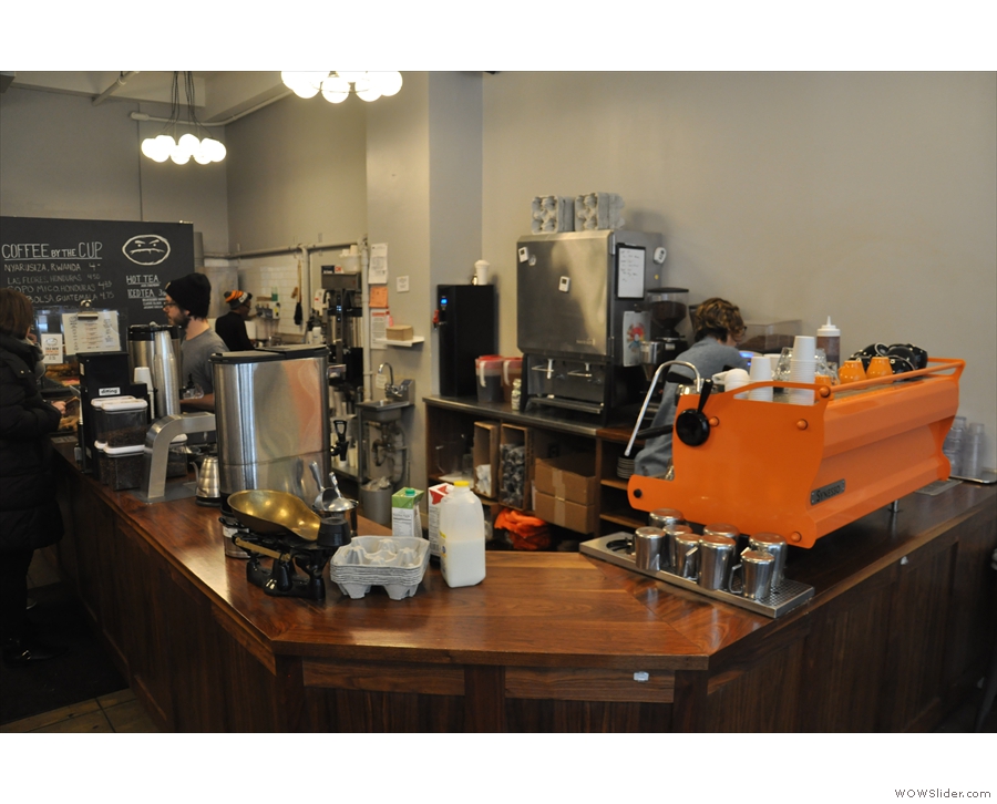 The counter is on the right-hand side, it's bright Synesso greeting you as you enter.