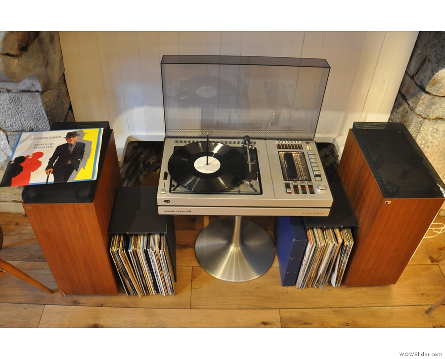 ... which houses a turntable and a large collection of records.