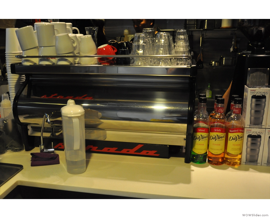 The counter also dispenses espresso from two gleaming La Marzoccos, a Strada at the front...