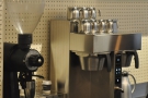There's a batch-brewer and an EK-43 grinder. The Aeropresses are made on the counter.