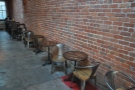 ... followed by a long row of two-person tables against the right-hand wall.