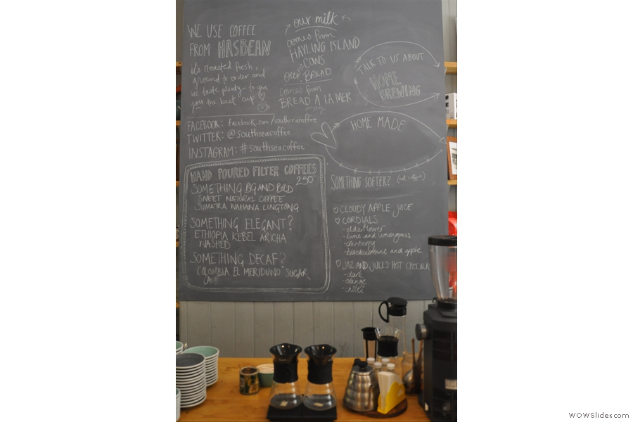 The beans are described on the blackboard behind the brew bar.