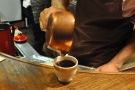 With a final flourish, the coffee is poured into the cup... 