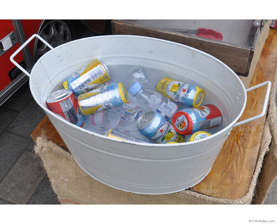 There are also soft drinks, kept cold in this tub of iced water.