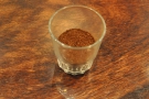 The ground coffee. I didn't ask the grind setting: slightly coarser than Aeropress, perhaps?