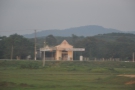 Roadside church, with hills as a backdrop.