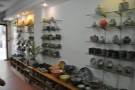 The shelves are packed with beautiful pottery.