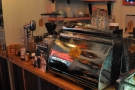 In the middle, between the two grinders, is the Victoria Arduino lever espresso machine...