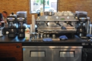 The espresso machine & its grinders, seen from the front of the counter.