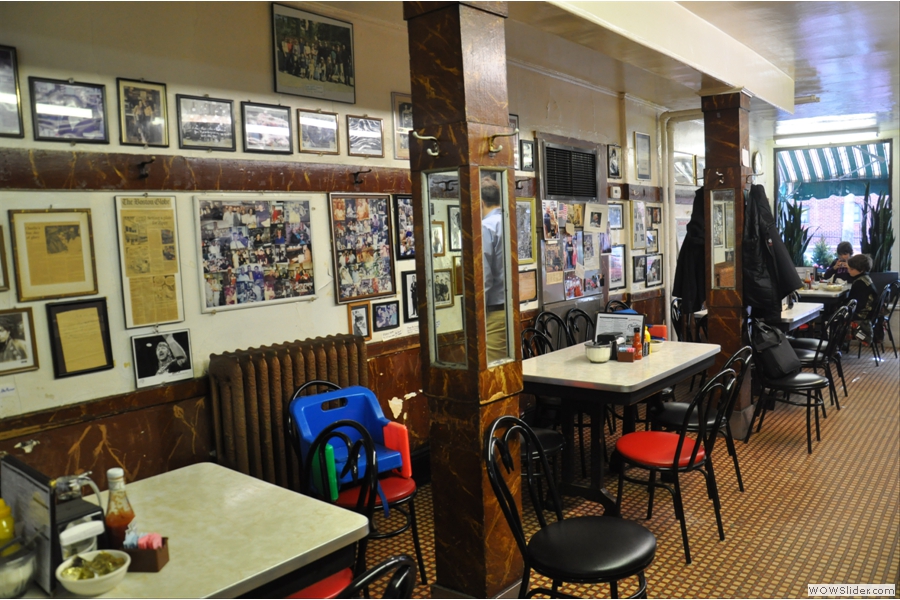 The walls are adorned with pictures of famous patrons from over the years.
