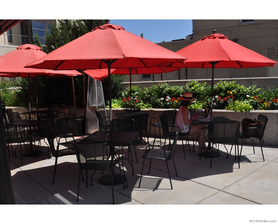 ... while off to the right is an outdoor seating area with a handful of shaded tables.