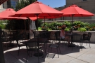 ... while off to the right is an outdoor seating area with a handful of shaded tables.