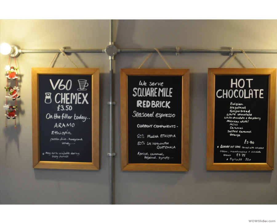 The coffee (and hot chocolate) options are on the wall opposite.