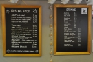 The menus are on the wall behind the counter: food (left) and drinks (right).