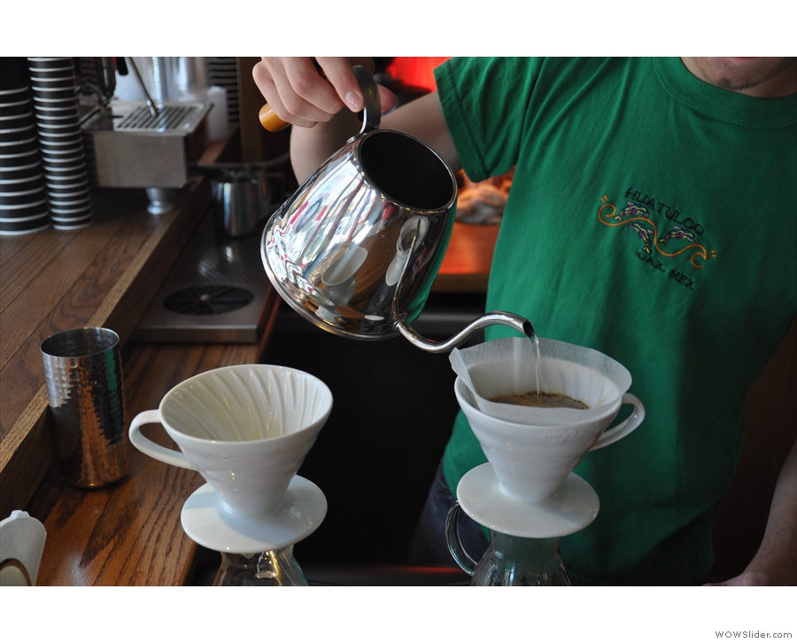 ... in a single pour, the kettle being moved around the surface of coffee. No stirring here.