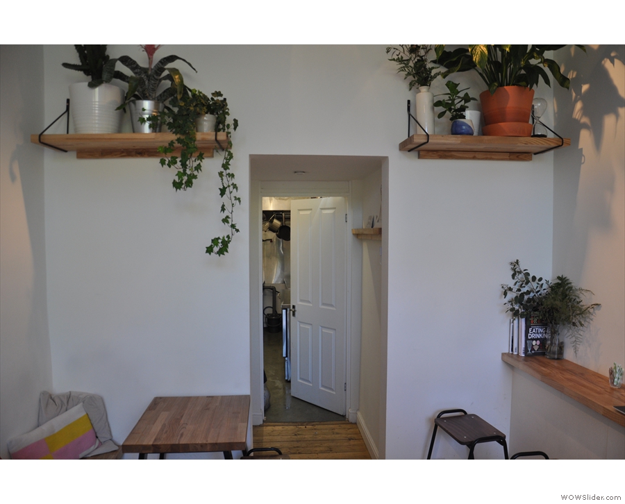 The door at the back leads to the toilets (on the left) & the kitchen (right at the back).