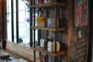 Some of the brick pillars between the windows are used as retail shelves...