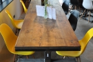 There's plenty of seating in the front, such as this communal table on the right...