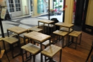 ... while the tables in the window, which used to be very regimented in their spacing...