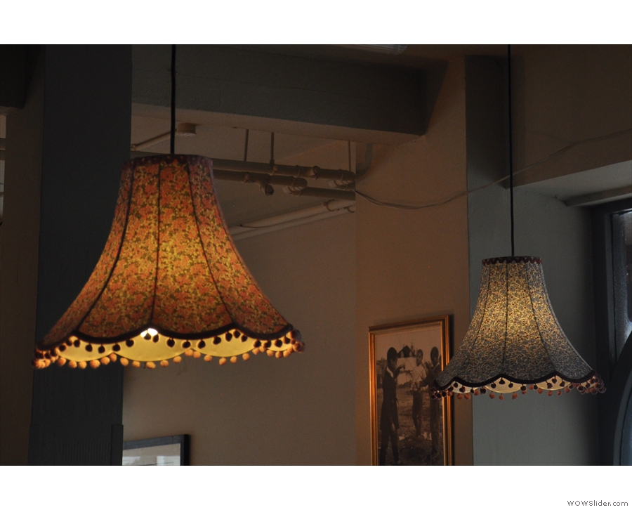 There are the usual exposed light bulbs, but also some proper lampshades...