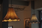 There are the usual exposed light bulbs, but also some proper lampshades...