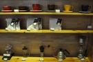 The retail shelves have all the usuals: cups, coffee and coffee-making kit.