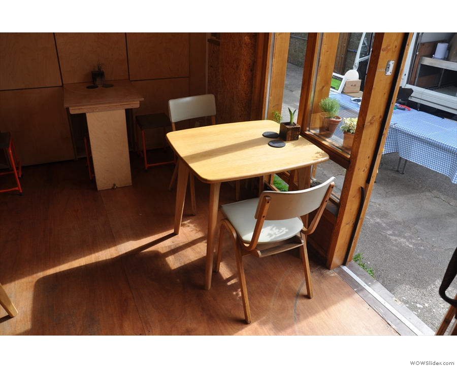 There's plenty of seating in here, such as this two-person table to the right of the door.