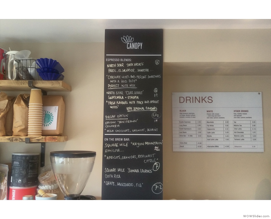 The coffee menus are conveniently on the wall behind the till, to your left as you enter.