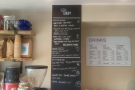 The coffee menus are conveniently on the wall behind the till, to your left as you enter.