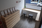 ... a deeply-recessed door creates seating areas on either side. However, Coffee + Beer...