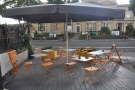 ... the tables were huddled under the umbrella, as seen here, looking towards the road.