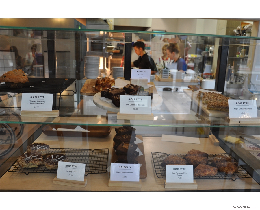 There are cakes in the glass display case to the left...