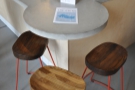 There's one more seating area, three bar stools around a circular bit at the counter's end.