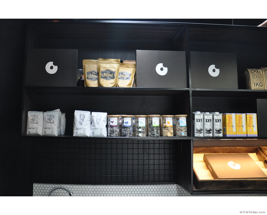 There's coffee, tea, hot chocolate and more on the shelf behind the espresso machine...