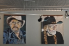 Various large portraits hang in the front part of Johnson Public House.