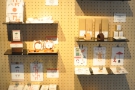 Back inside, Vermillion has two racks of merchandising shelves, selling coffee...