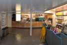 A short, wide corridor leads straight ahead to the counter, while the seating's off to the...