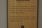 A plaque, dedicated to Shape Studio, which designed the cafe and its furniture.