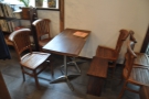 This is on the left, although it's technically a pair of two-person tables pushed together.