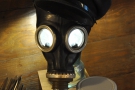 ... while this old gas-mask has been pressed into service as a light-fitting.