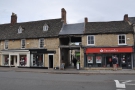 On  Witney High Street, opposite Welch Way, there's an opening between the buildings.
