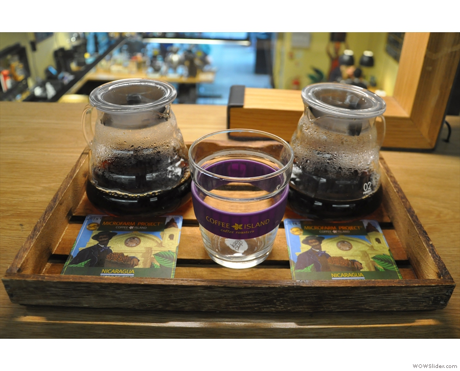 They are presented in carafes, on a wooden tray, with a Keep Cup as a glass.