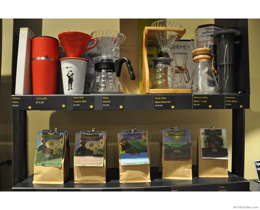 Back downstairs, and there are lots of retail shelves, selling bags of coffee & coffee kit.