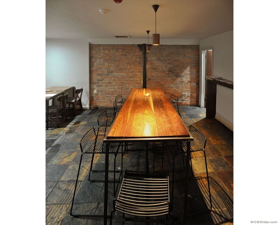 The second part of the basement is dominated by this long communal table.