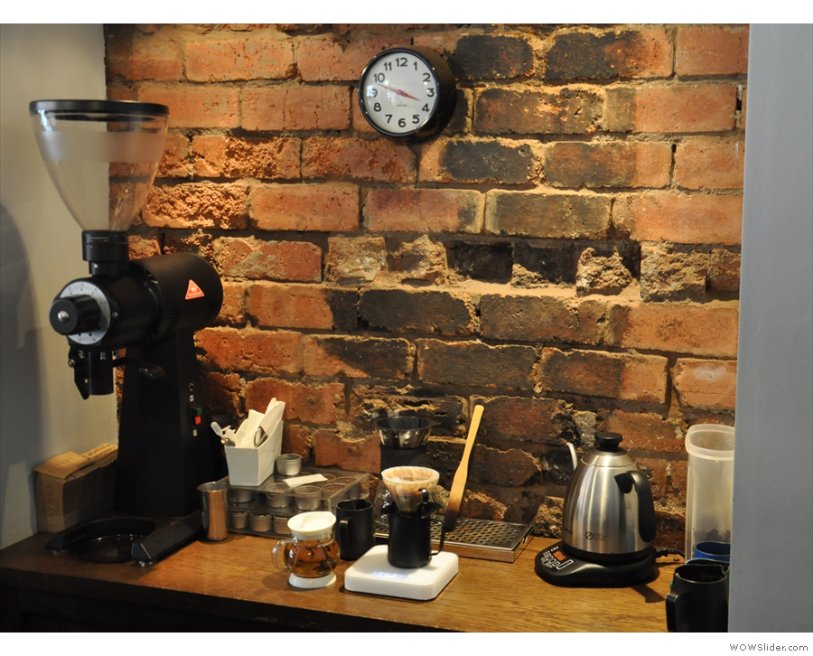 Meanwhile, in a niche in the back wall, is the pour-over area, complete with EK-43 grinder.